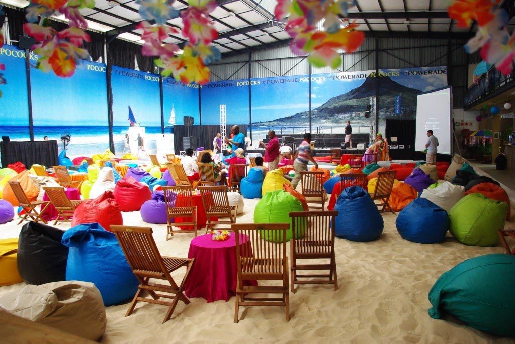 Colorful bean bag seating on indoor-style beach reflecting the skills to be an event planner
